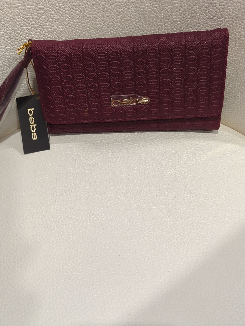 bebe Plum Textured Wristlet Wallet with Gold Logo